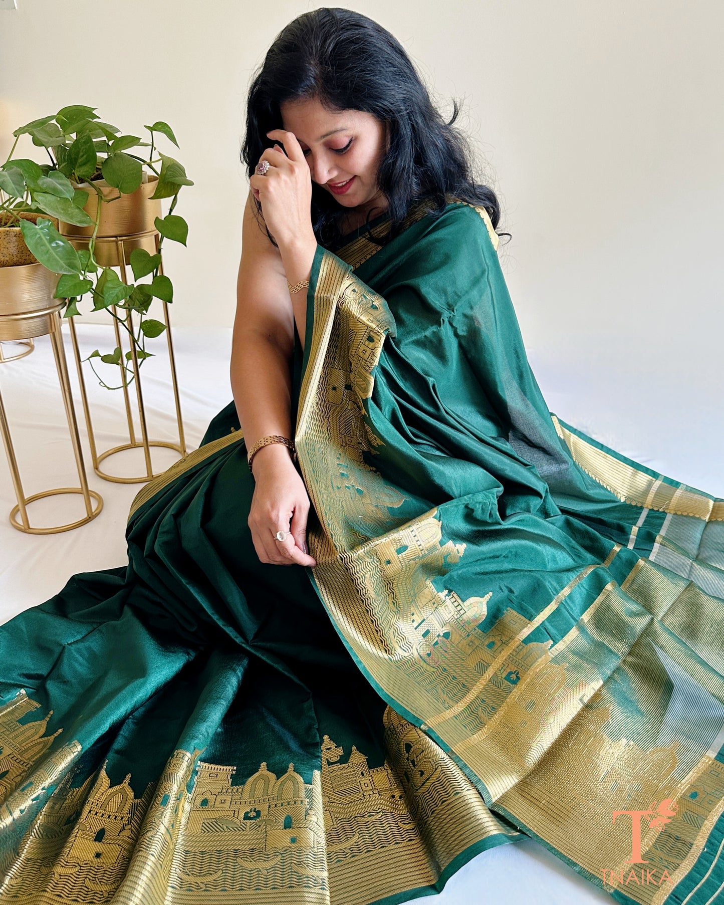 emerald green crepe silk saree with grand zari border