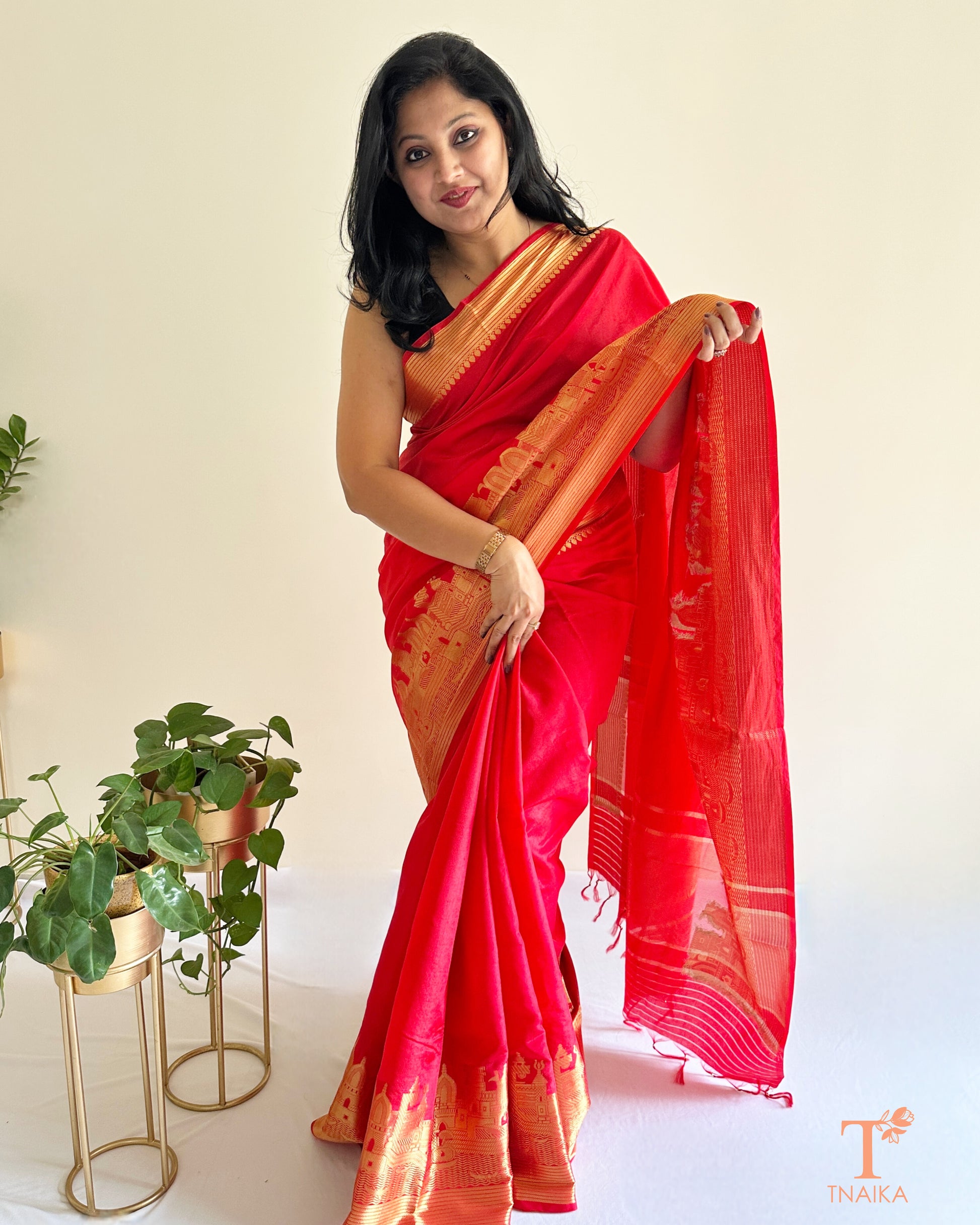 scarlet red crepe silk saree with grand zari border