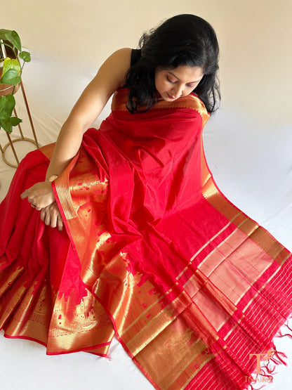 traditional red silk saree with temple inspired border