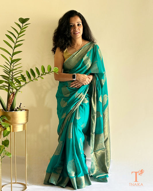 green chiffon saree with zari border