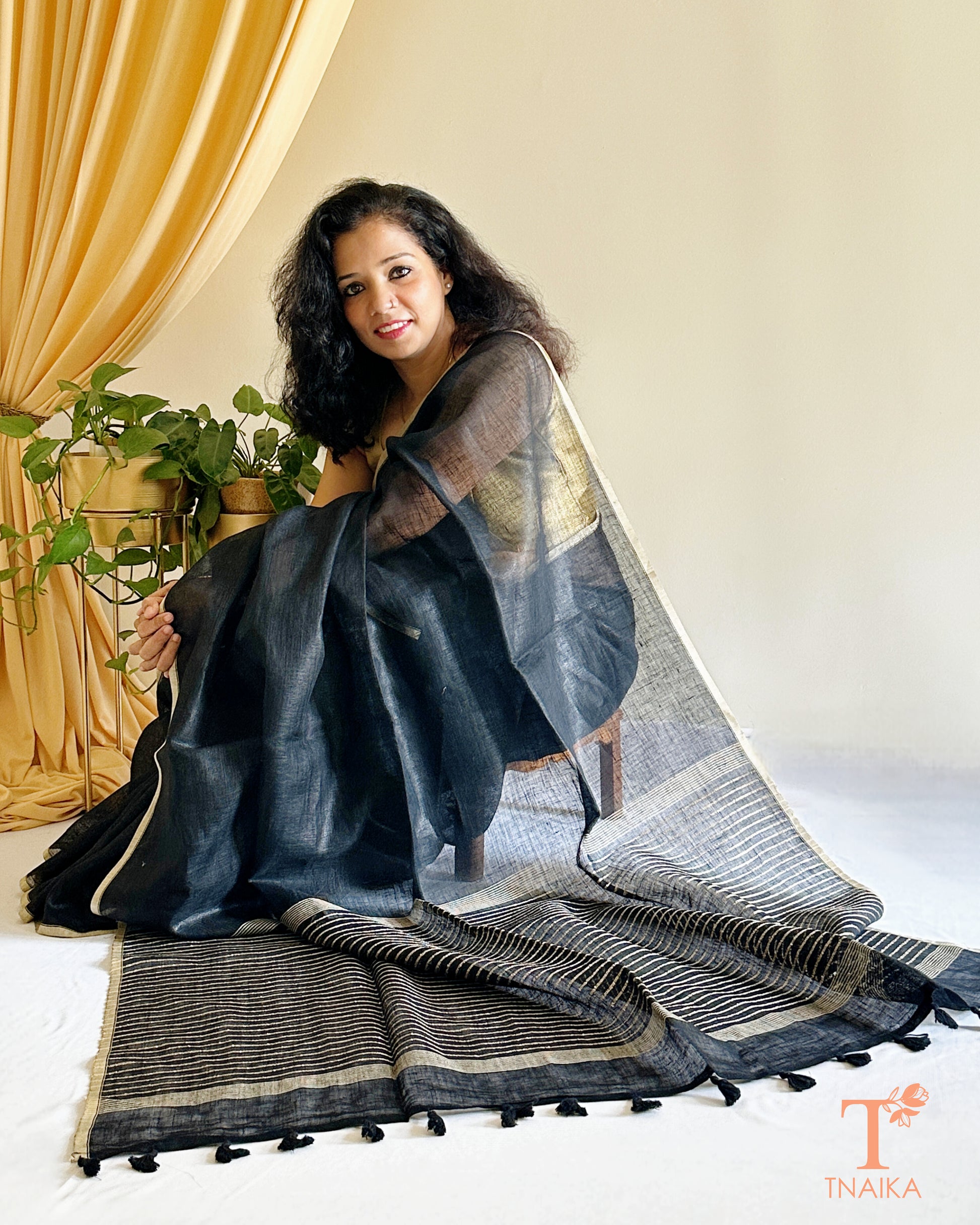 elegant linen saree in black with subtle stripe detail