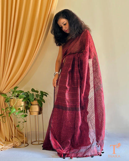 premium linen saree with subtle shimmer in deep maroon shade