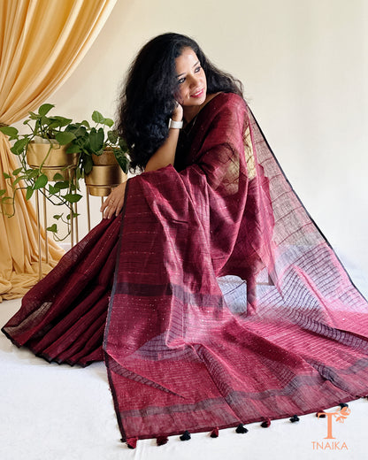 elegant wine linen saree with minimal sequence work