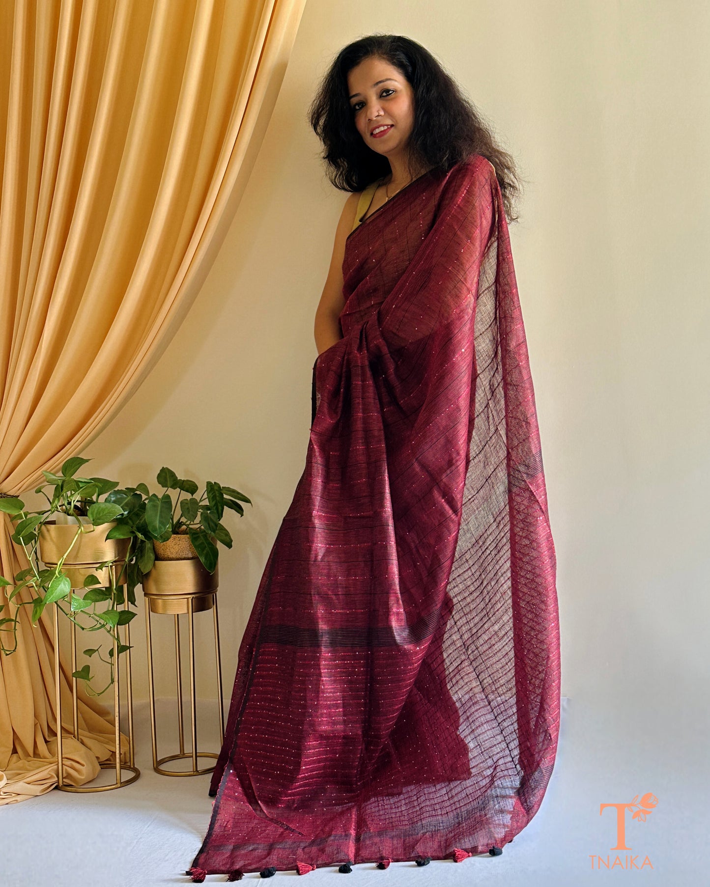 premium linen saree with subtle shimmer in deep maroon shade