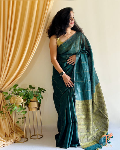 elegant dark green linen cotton saree with tassels