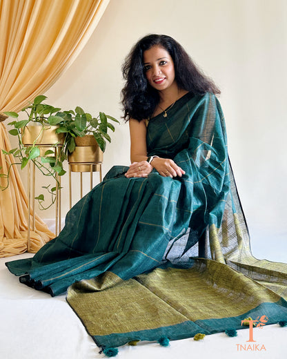 elegant dark green linen cotton saree with tassels