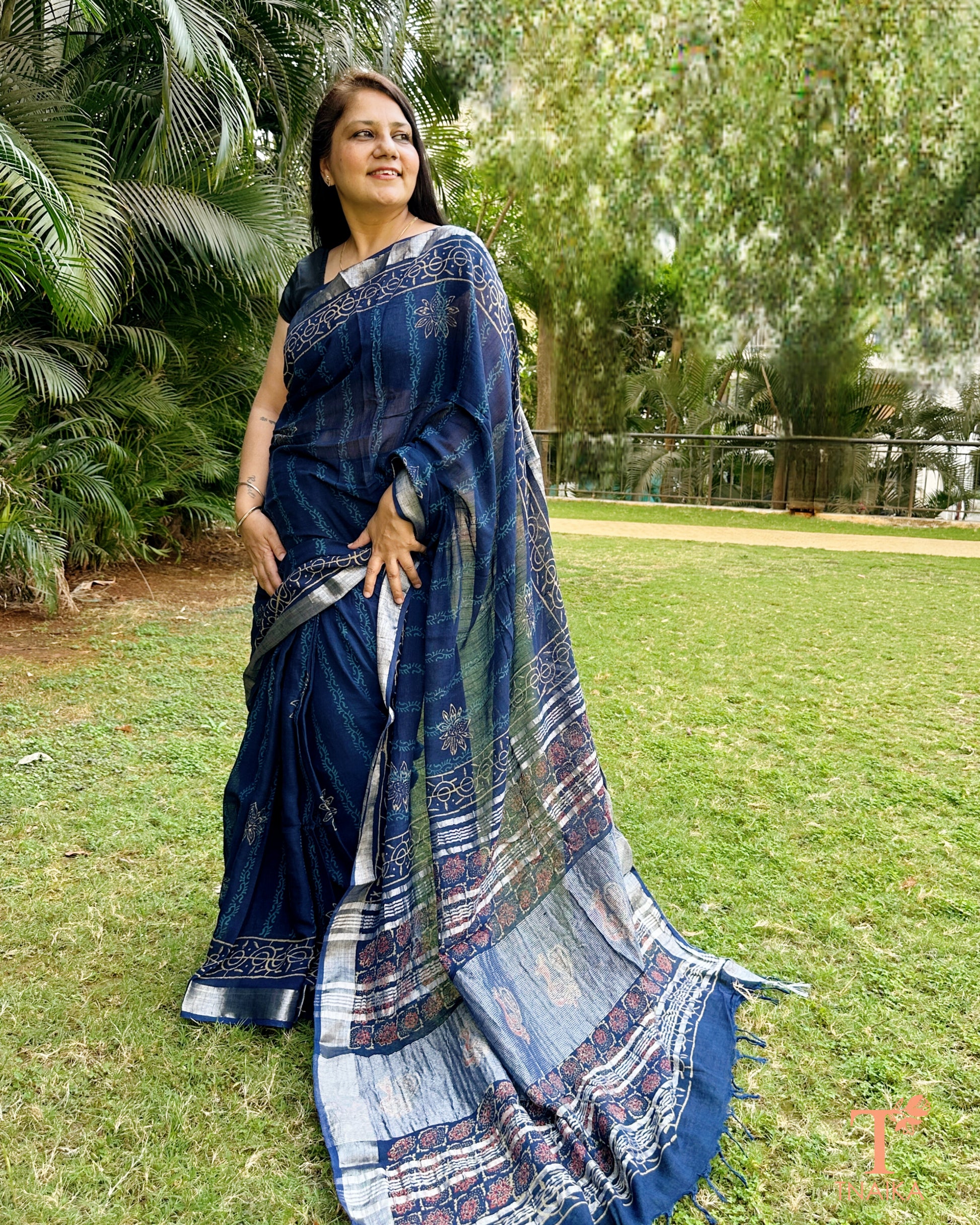 navy linen saree with contrast pallu and intricate design details