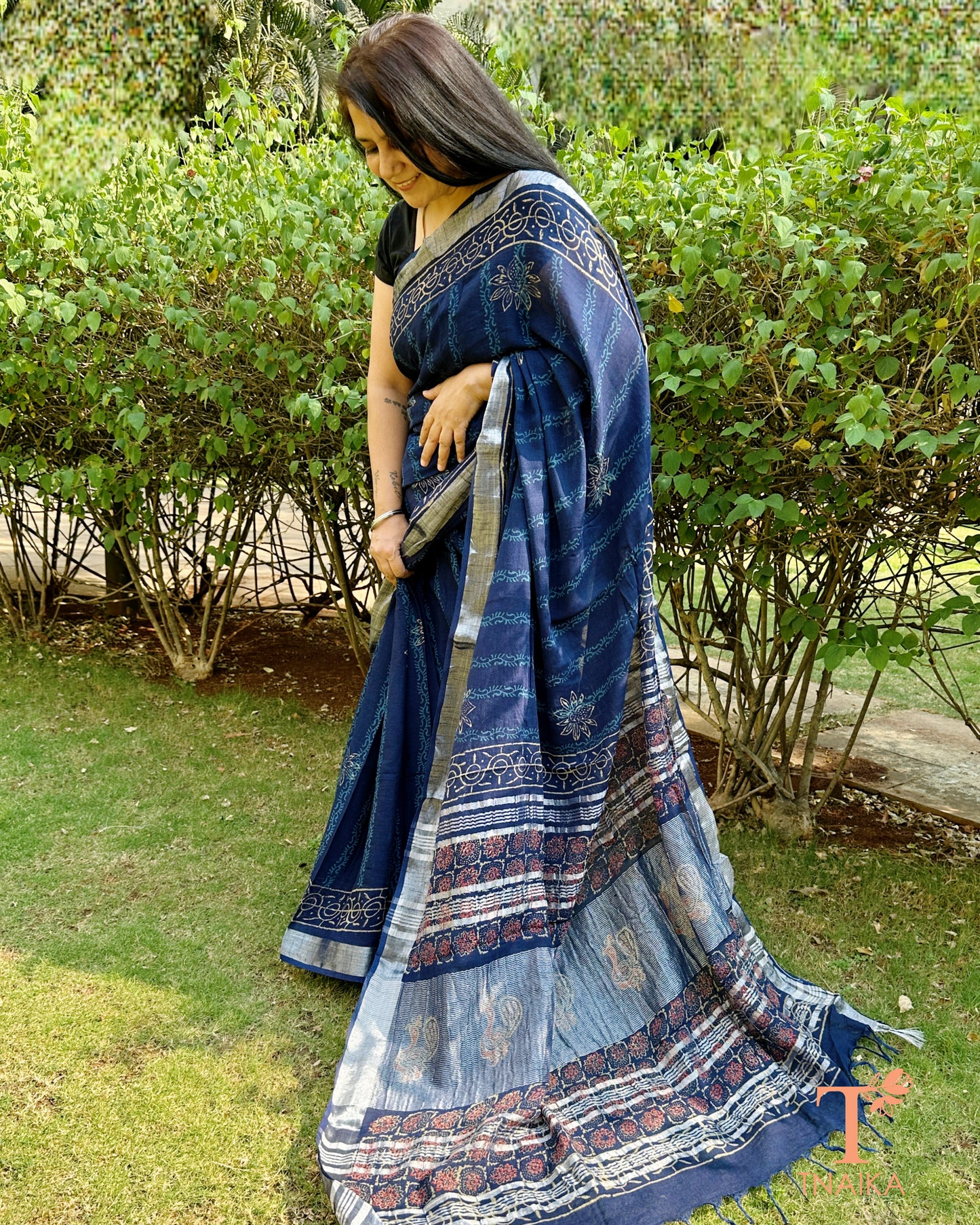 premium linen saree in navy blue with soft drape and tassel finish