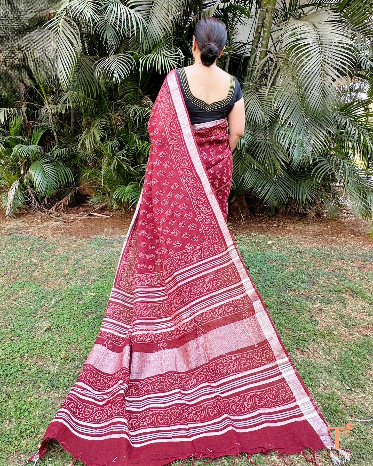 textured linen cotton saree in deep red with detailed pallu