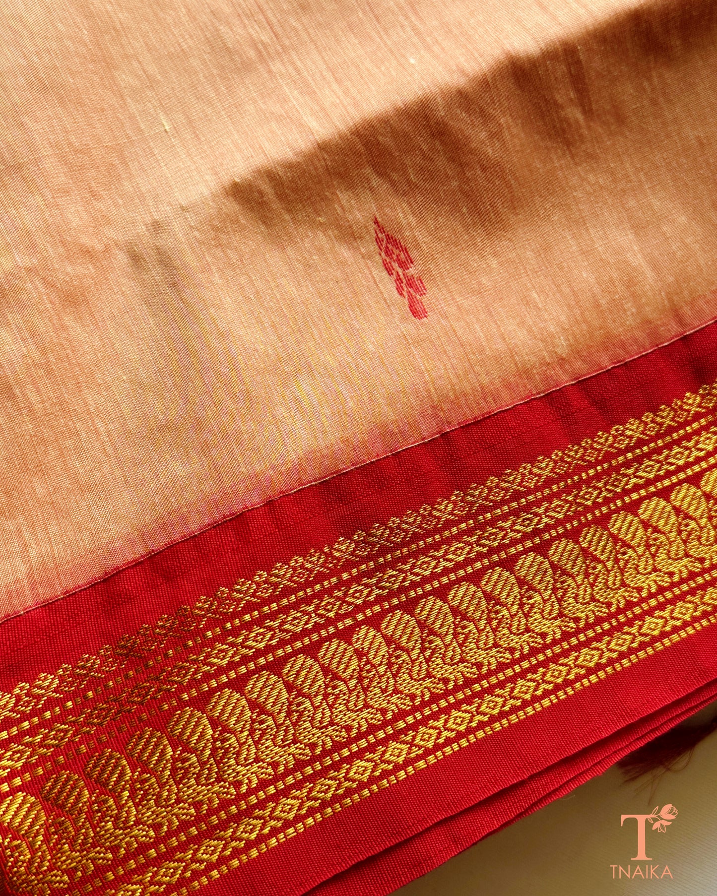 Cotton saree with zari woven border and subtle buti design