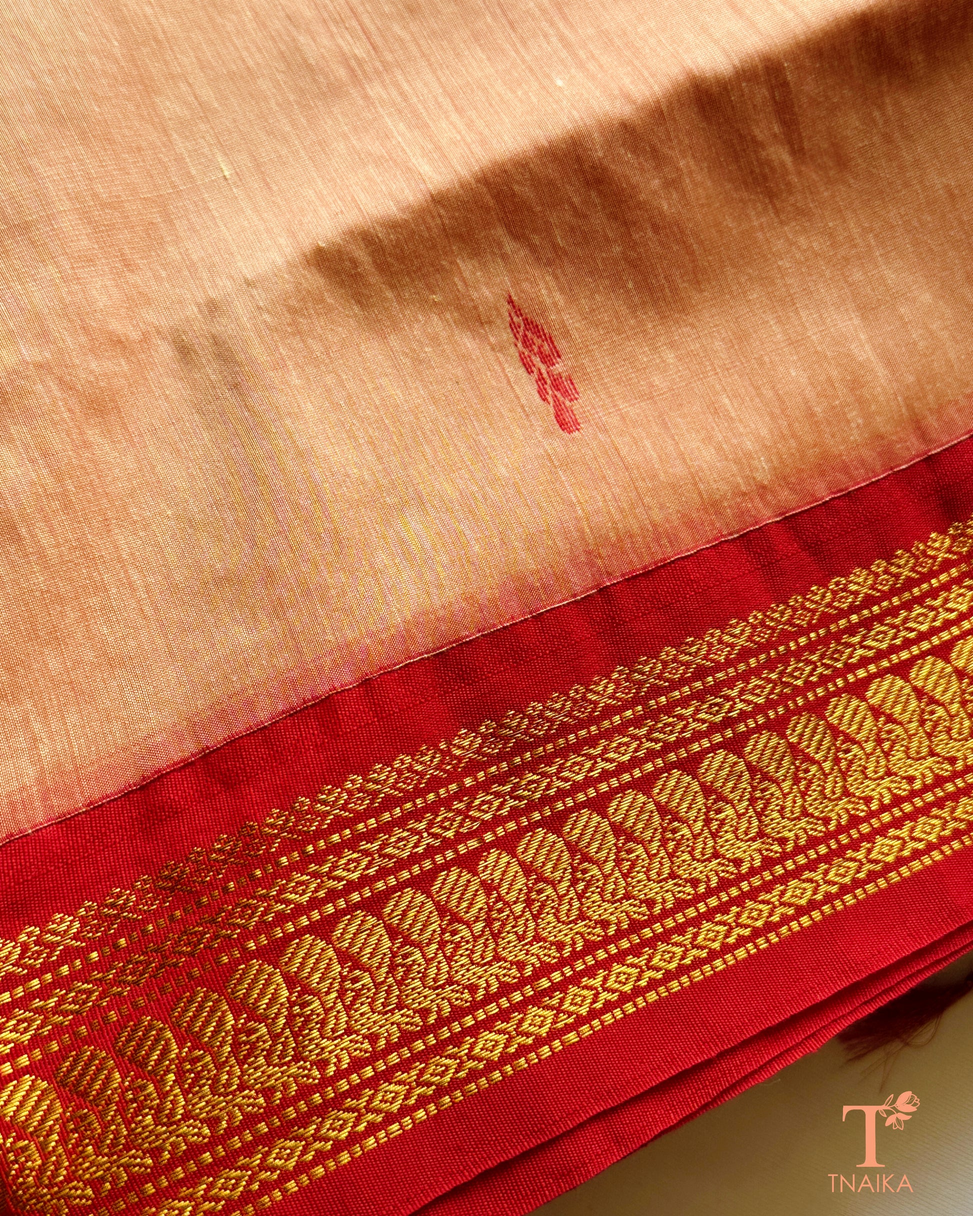 Cotton saree with zari woven border and subtle buti design