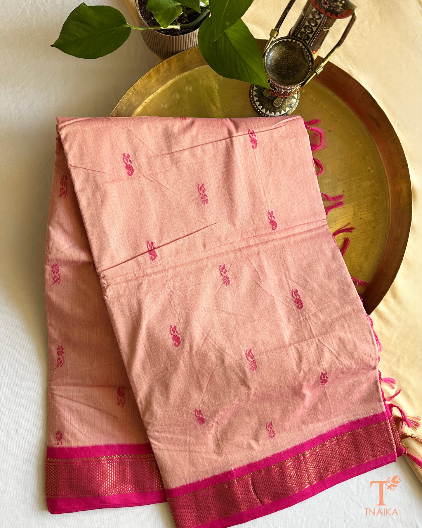 Cotton saree with zari woven border and subtle buti design
