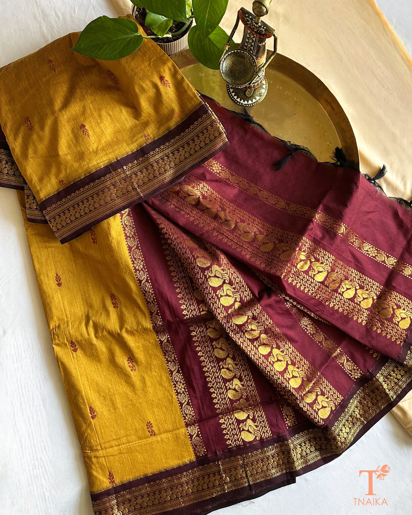 Lightweight cotton saree with intricate zari detailing on border