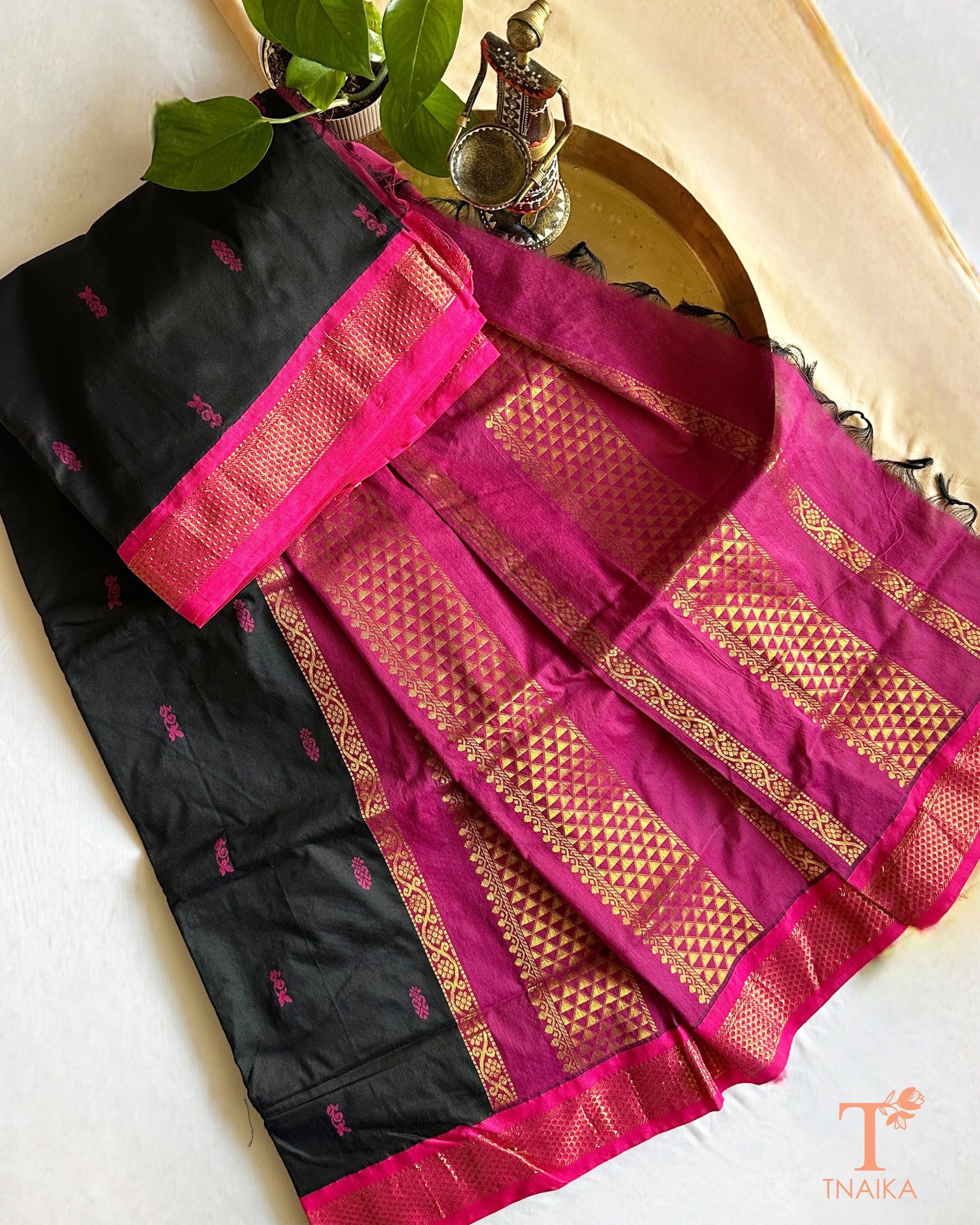 Soft cotton saree featuring traditional woven border and tassels