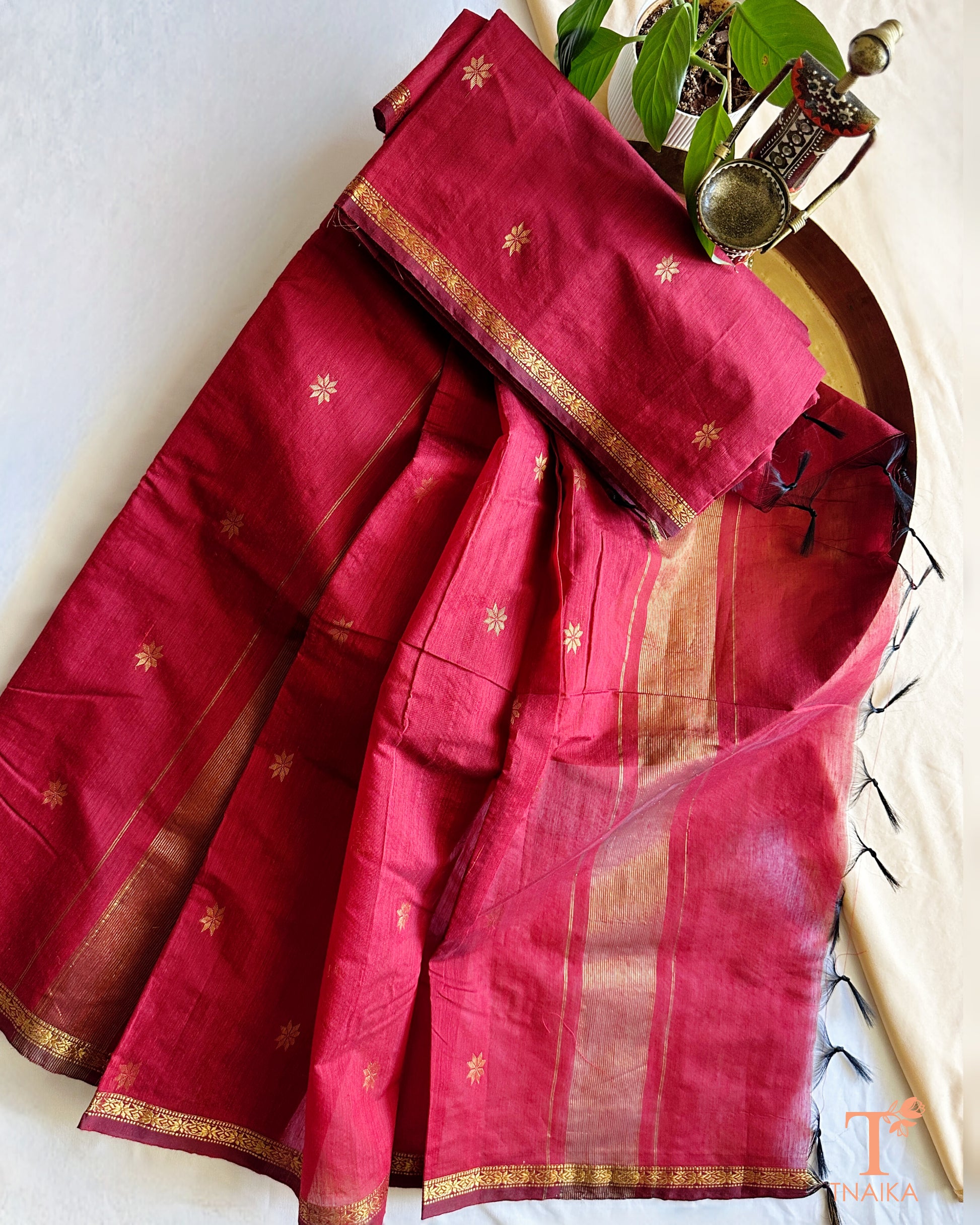 Elegant saree with fine zari border and soft textured body