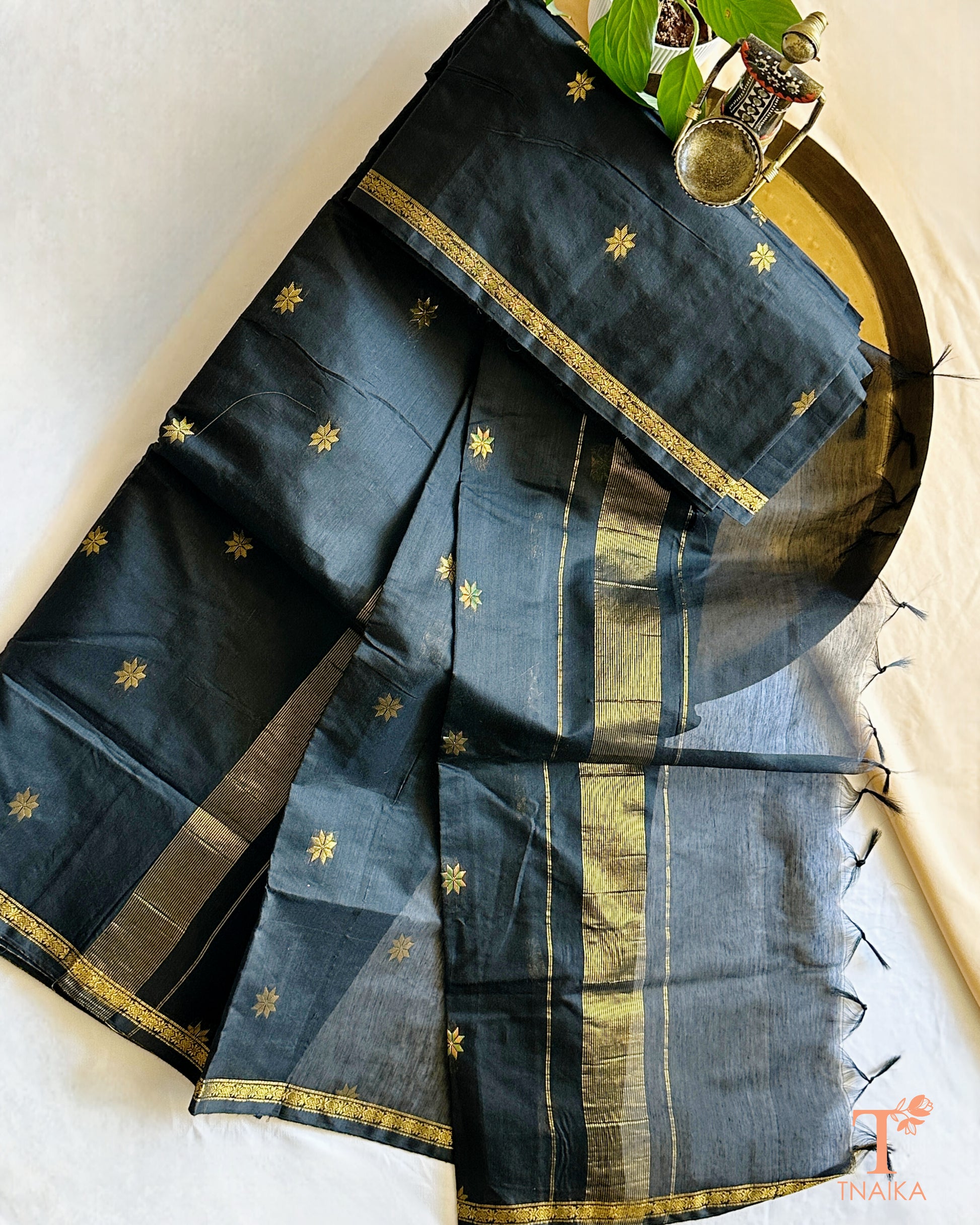 Elegant saree with fine zari border and soft textured body