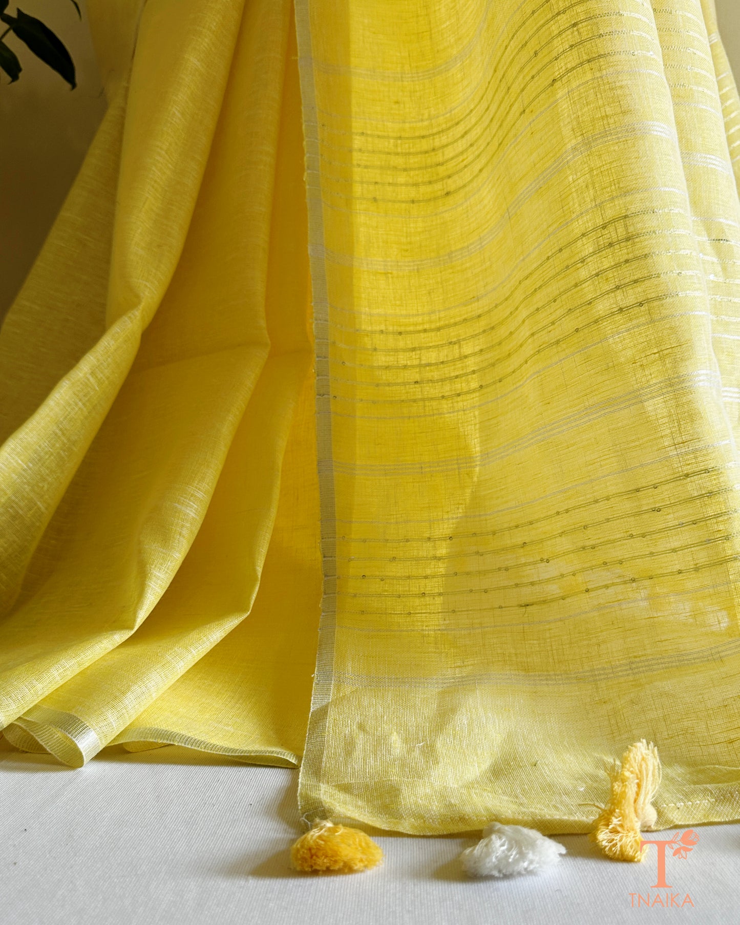 premium linen saree with zari border and minimal motifs