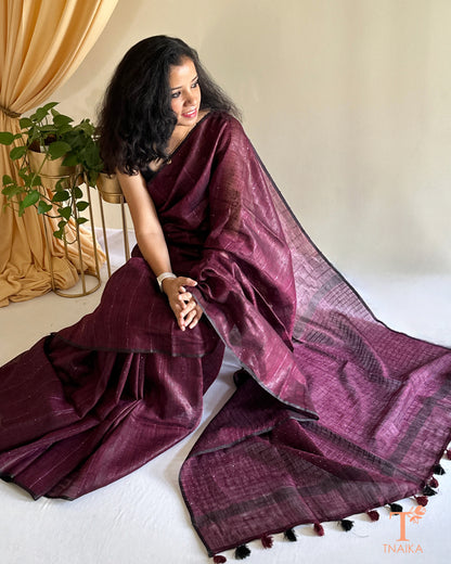 elegant linen saree with classic sequence pallu and tassels