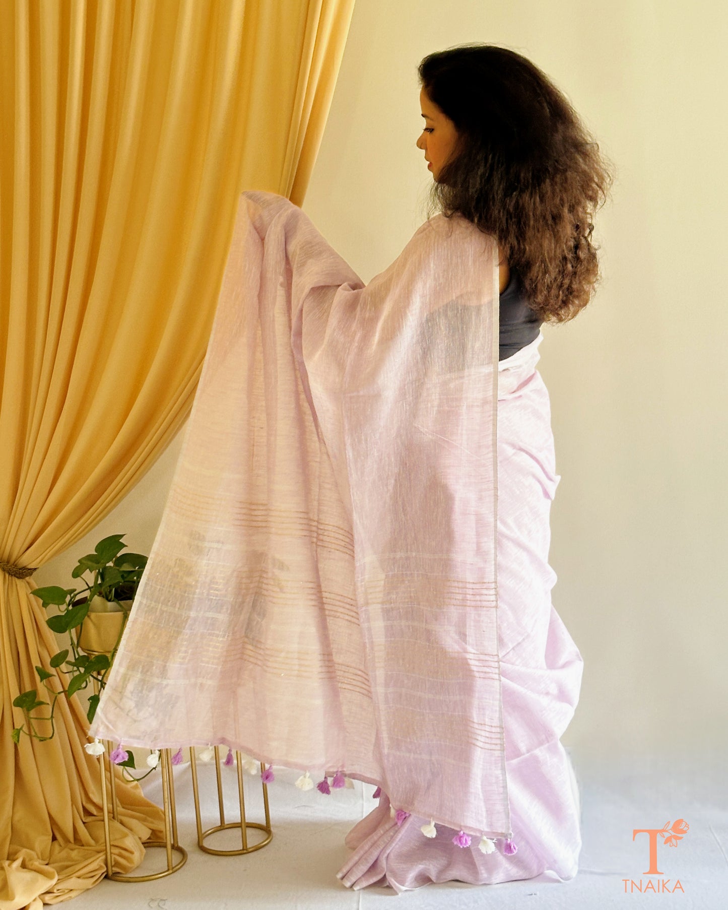 soft linen saree with subtle sheen and woven border
