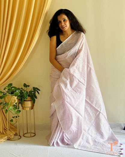 elegant linen saree with classic zari pallu and tassels