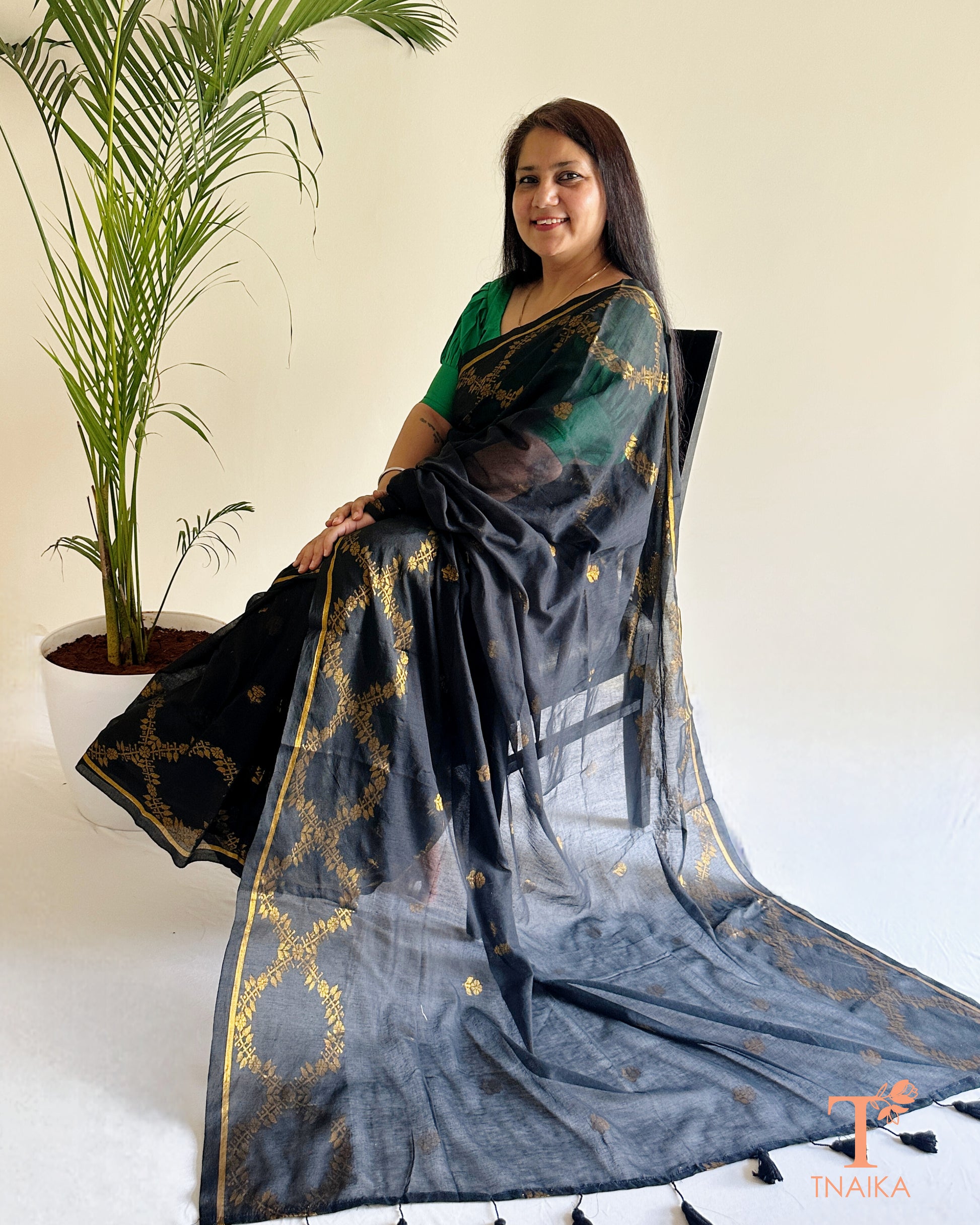 Sheer pallu mul cotton jacquard saree with minimal border and tassels