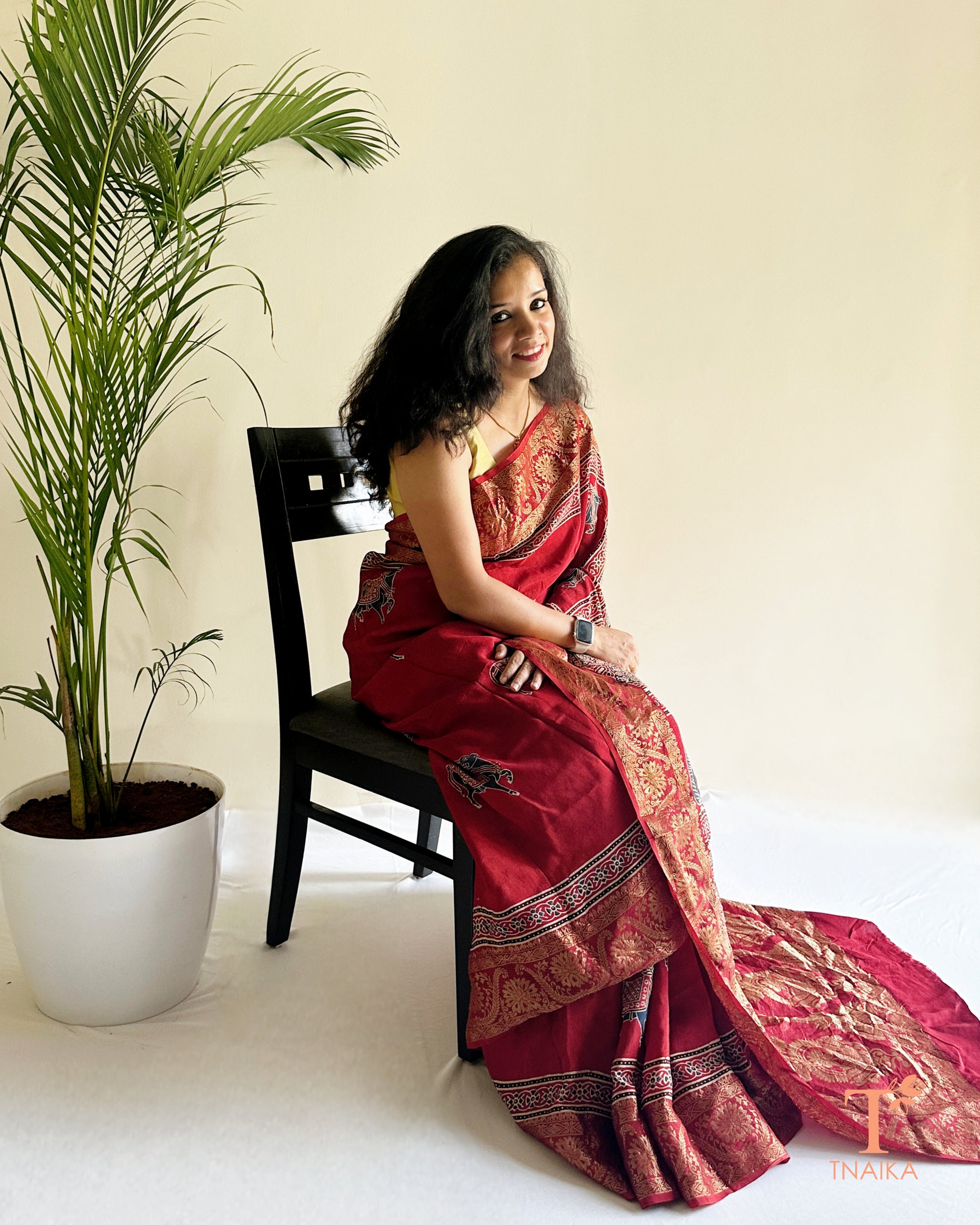 Festive dola silk saree with gold zari work and elegant drape