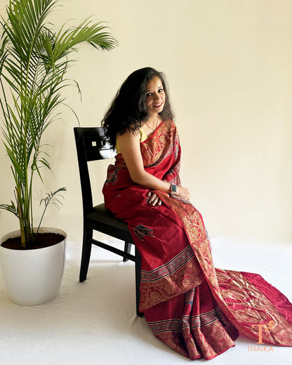 Festive dola silk saree with gold zari work and elegant drape