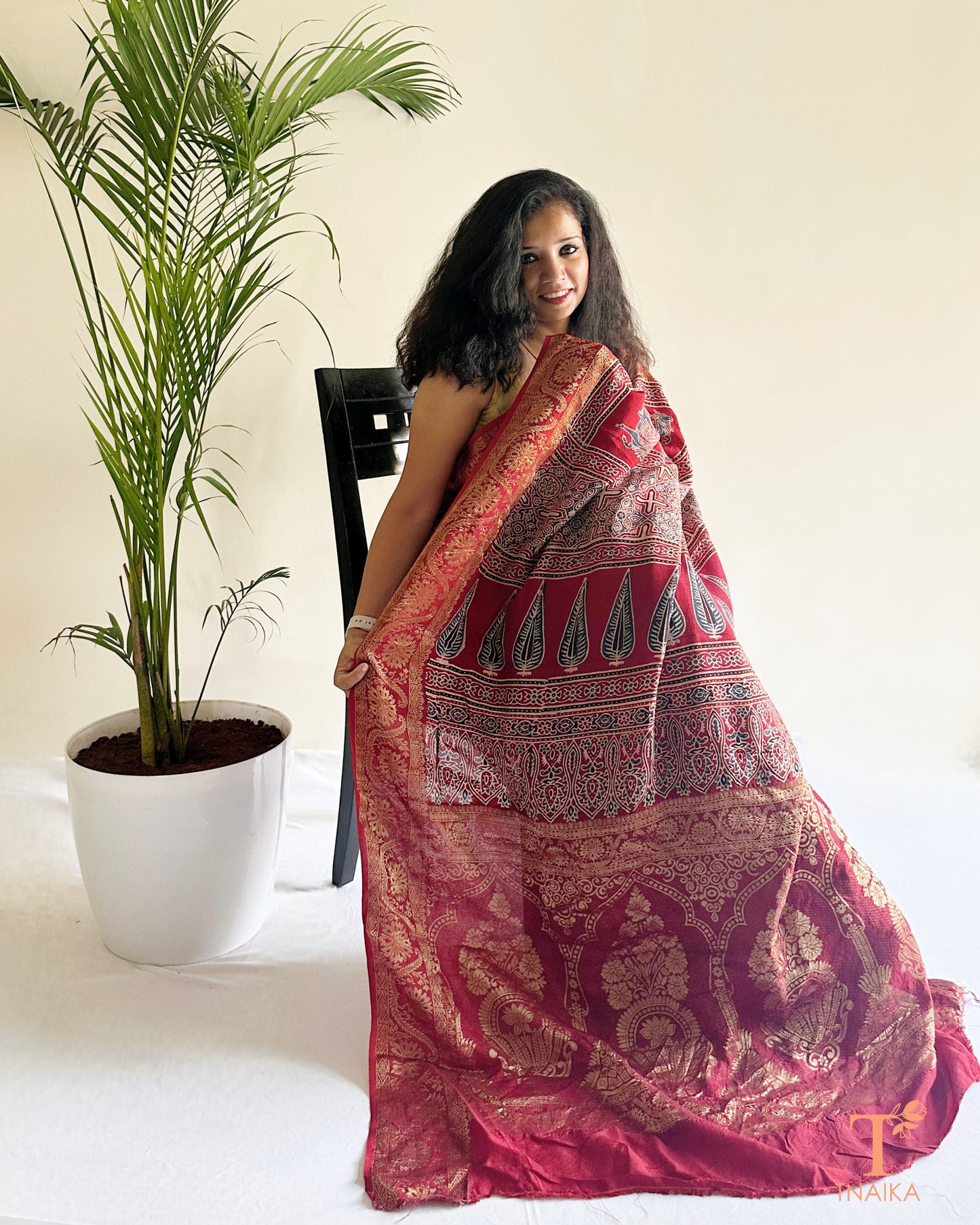 Festive dola silk saree with gold zari work and elegant drape