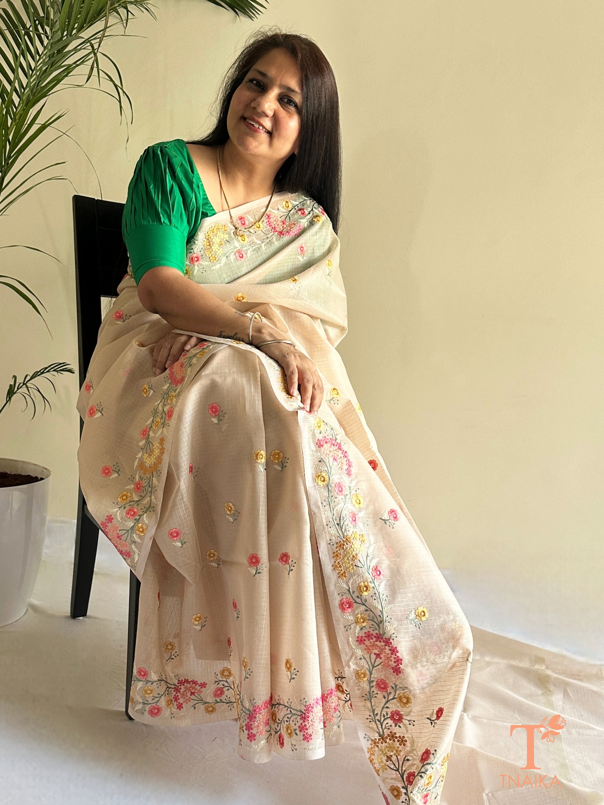 Breathable kota silk saree with scattered floral motifs and detailed pallu design
