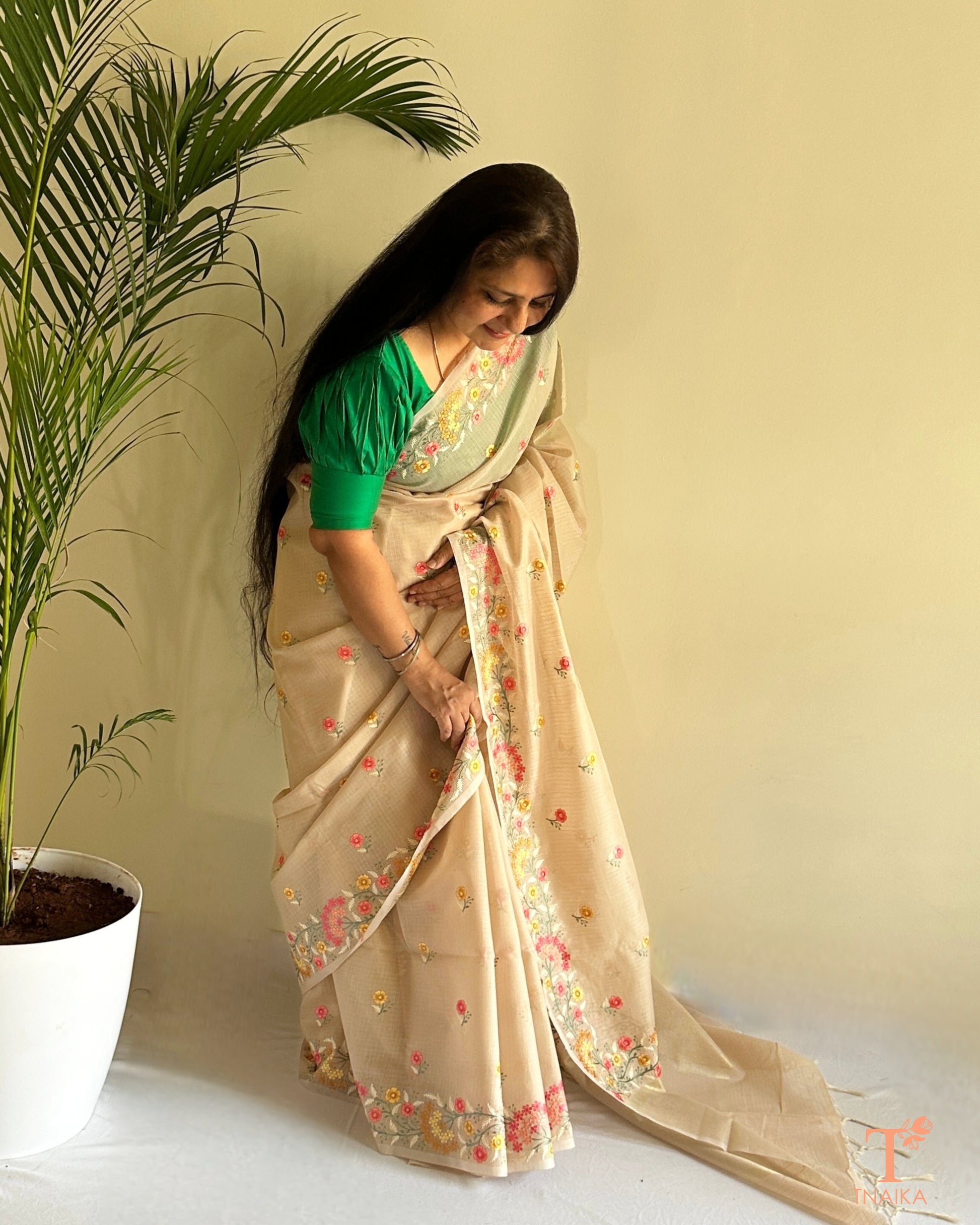 Sheer kota silk saree with pastel floral thread work and embroidered border