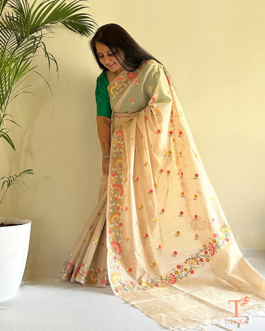 Kota silk saree with delicate floral thread embroidery in soft beige tone