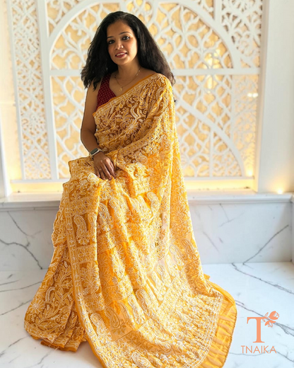 Traditional mustard chikankari saree with fine hand embroidery throughout