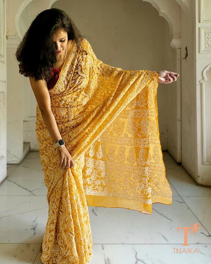 Elegant mustard chikankari saree featuring all-over jaal thread work