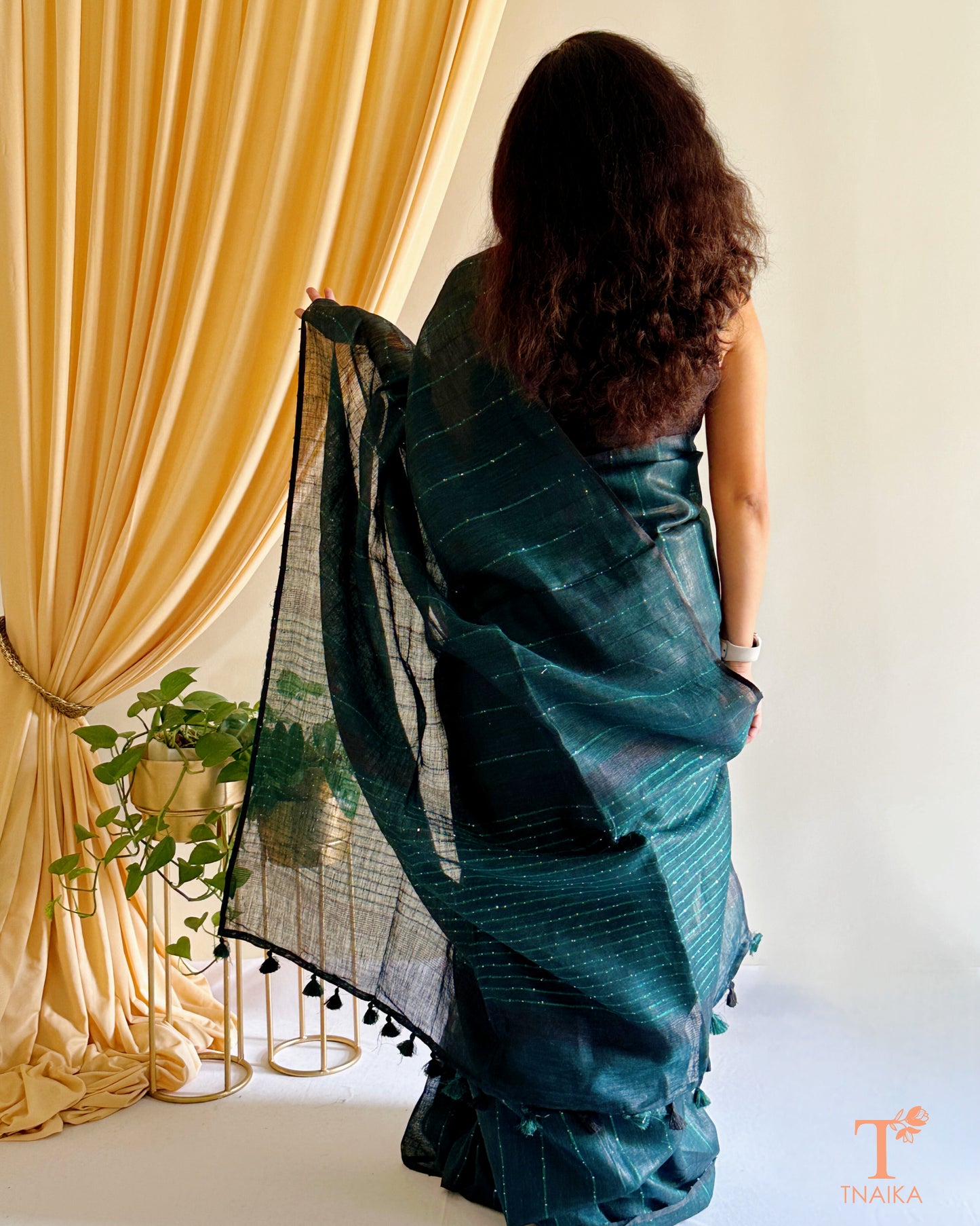 elegant linen saree with classic sequence pallu and tassels