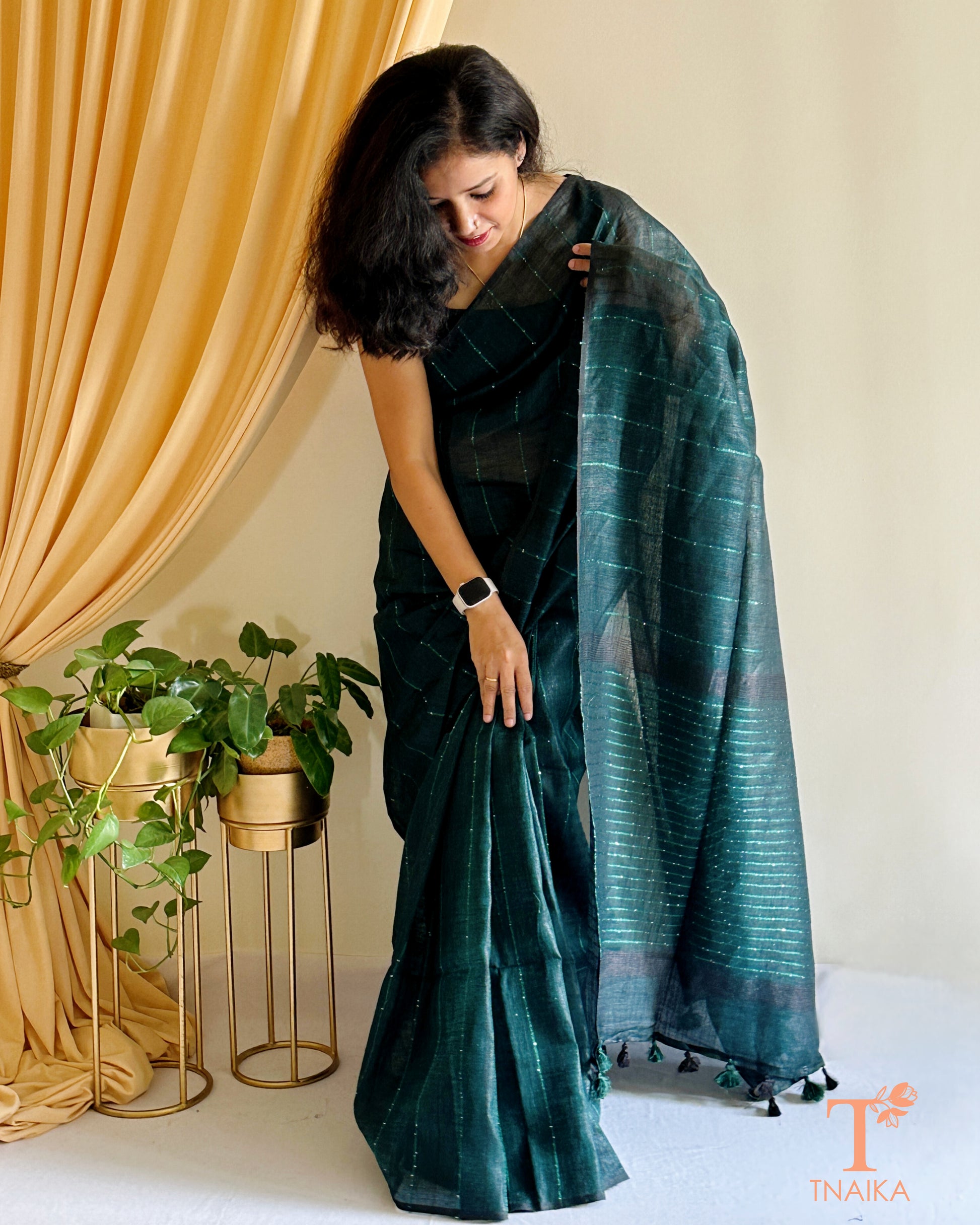 soft linen saree with subtle sheen and plain border