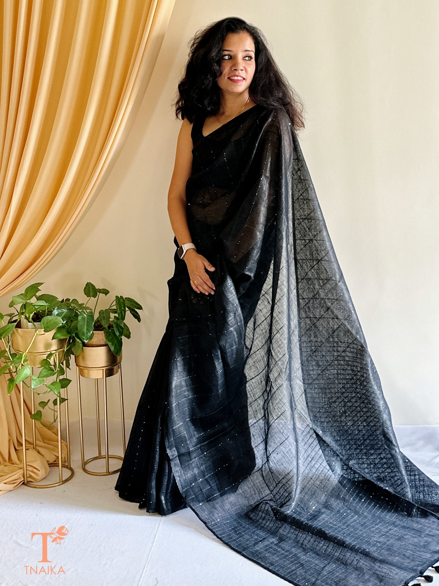 soft linen saree with subtle sheen and plain border