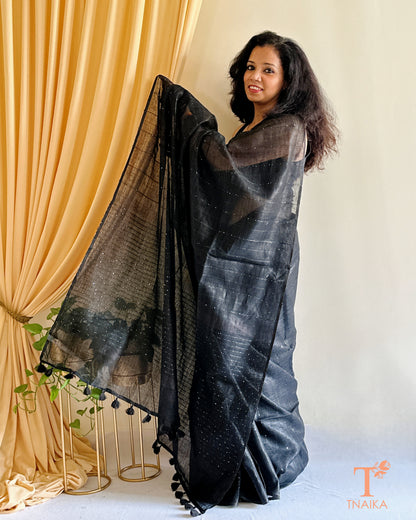elegant linen saree with classic sequence pallu and tassels