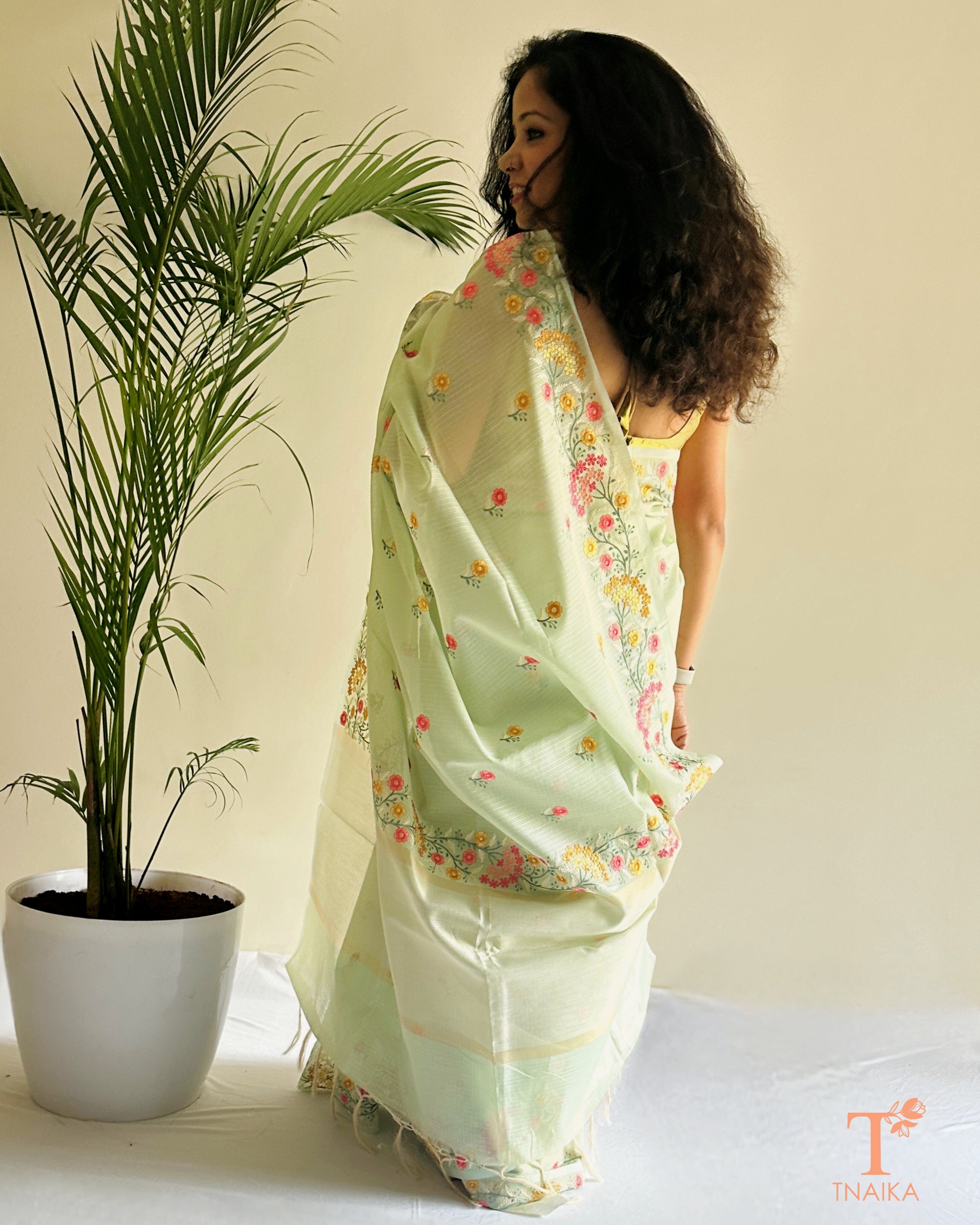 Kota silk saree with delicate floral thread embroidery in soft beige tone