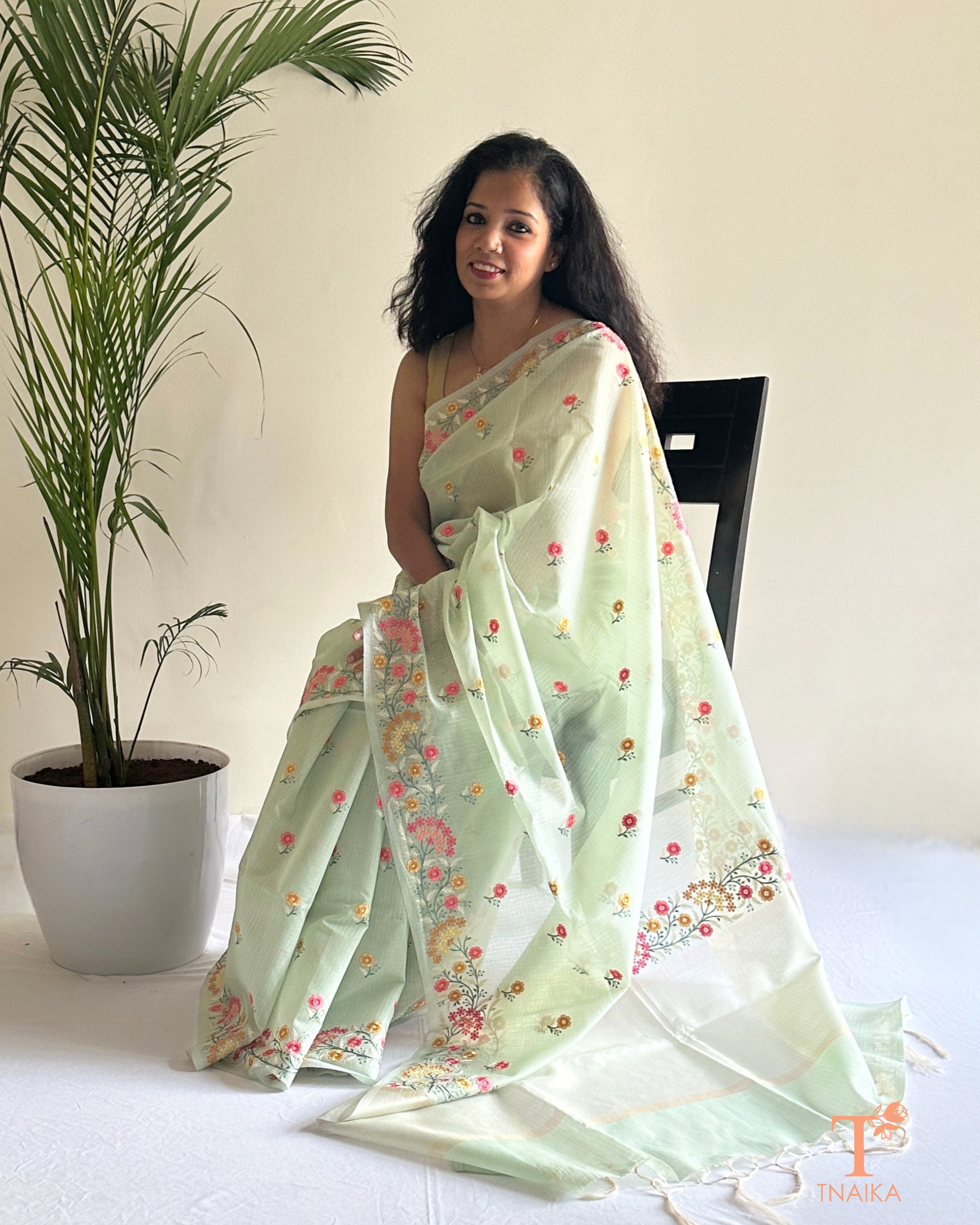 Sheer kota silk saree with pastel floral thread work and embroidered border