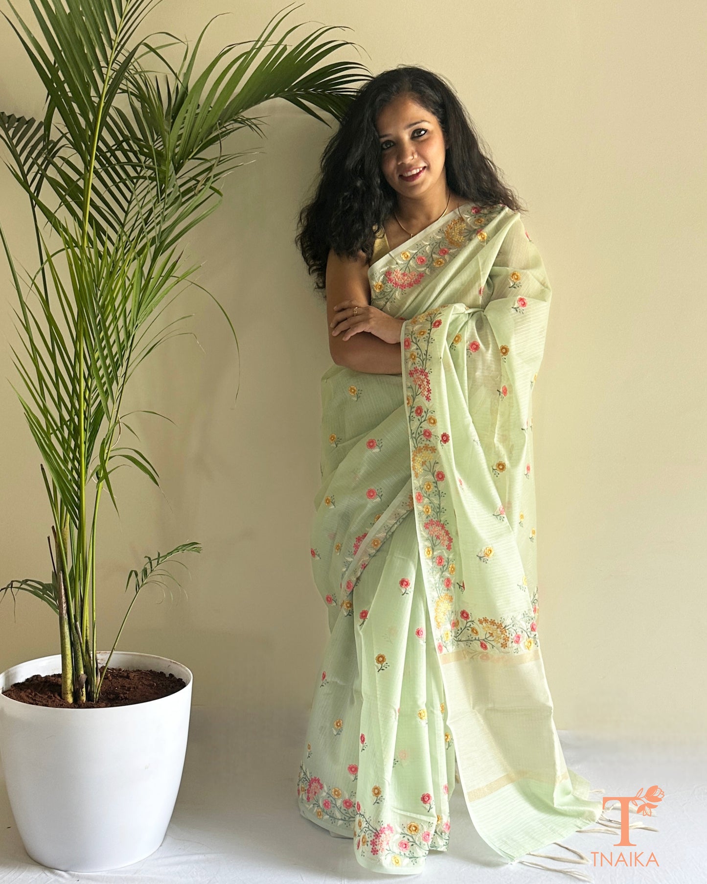 Beige kota silk saree with intricate hand-style thread embroidery and floral detailing