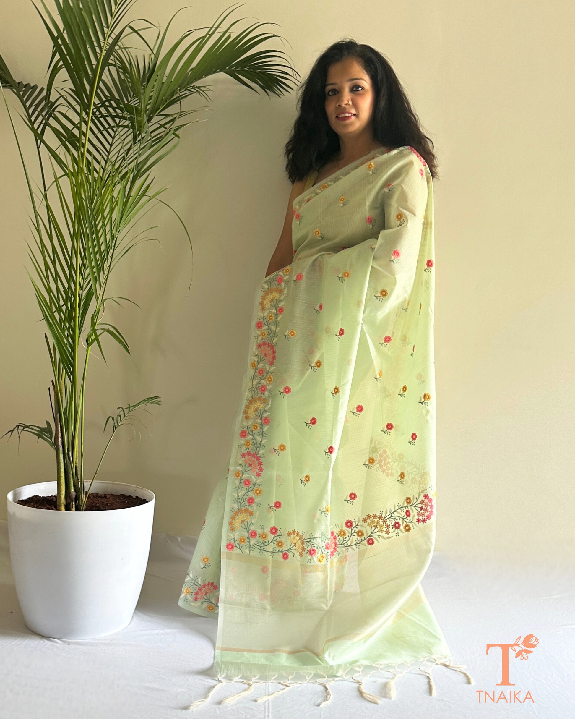 Sheer kota silk saree with pastel floral thread work and embroidered border