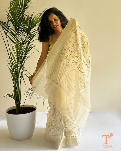 Lightweight tissue saree with leafy vine embroidery and tassels