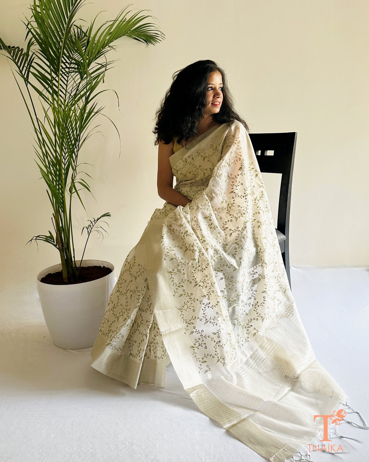 Embroidered ivory saree with striped pallu detailing