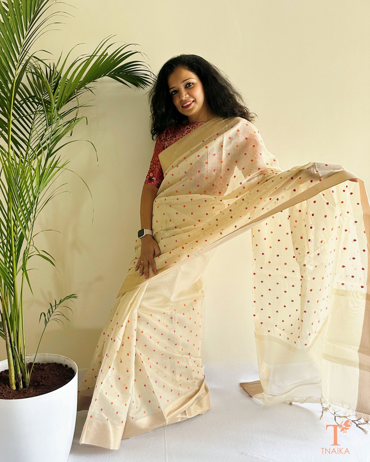 Elegant ivory saree with woven buti detailing and sheer texture