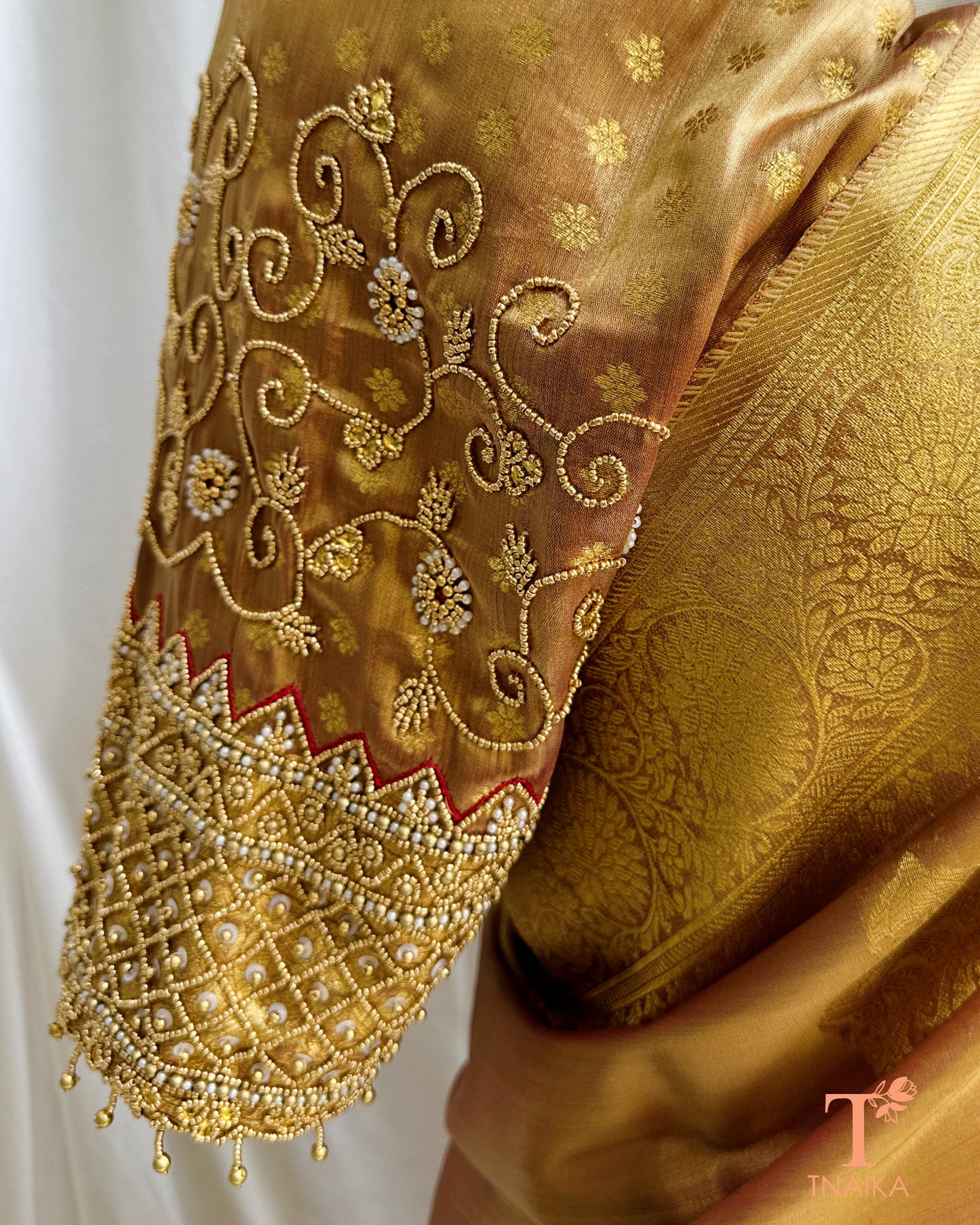 Close-up of heavy aari embroidered blouse with bead detailing