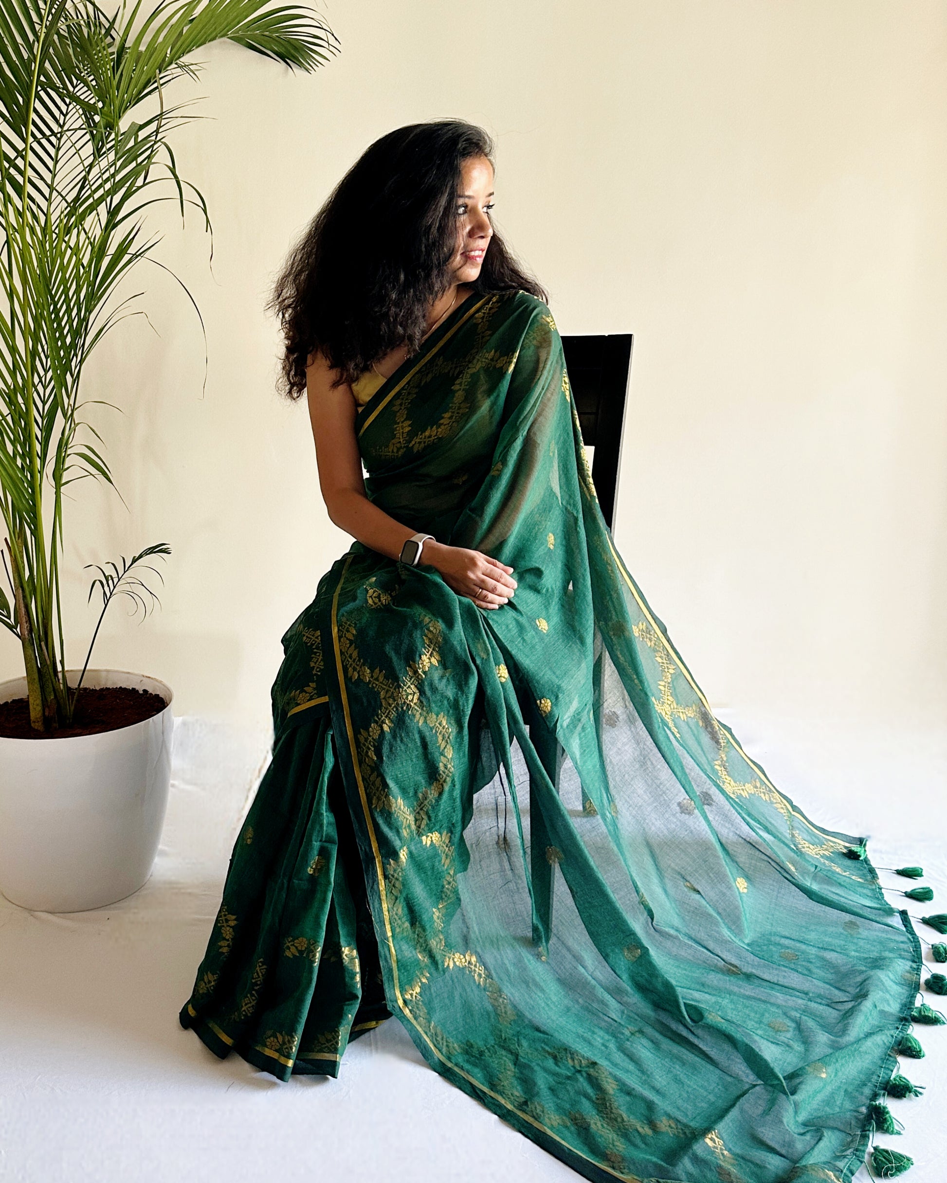 Minimal festive mul cotton saree with gold motifs and airy finish