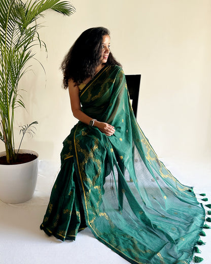 Minimal festive mul cotton saree with gold motifs and airy finish