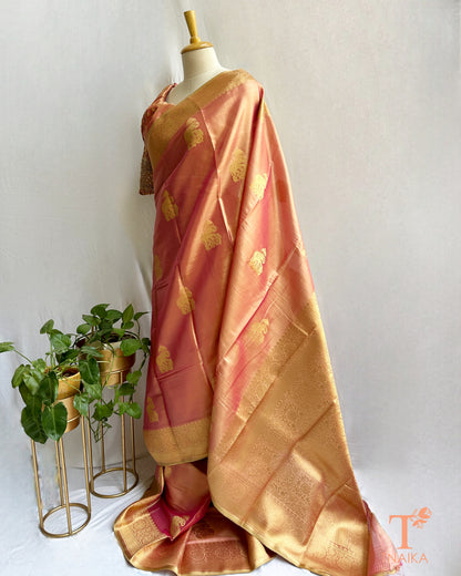 Elegant gold saree with traditional motifs and lustrous finish