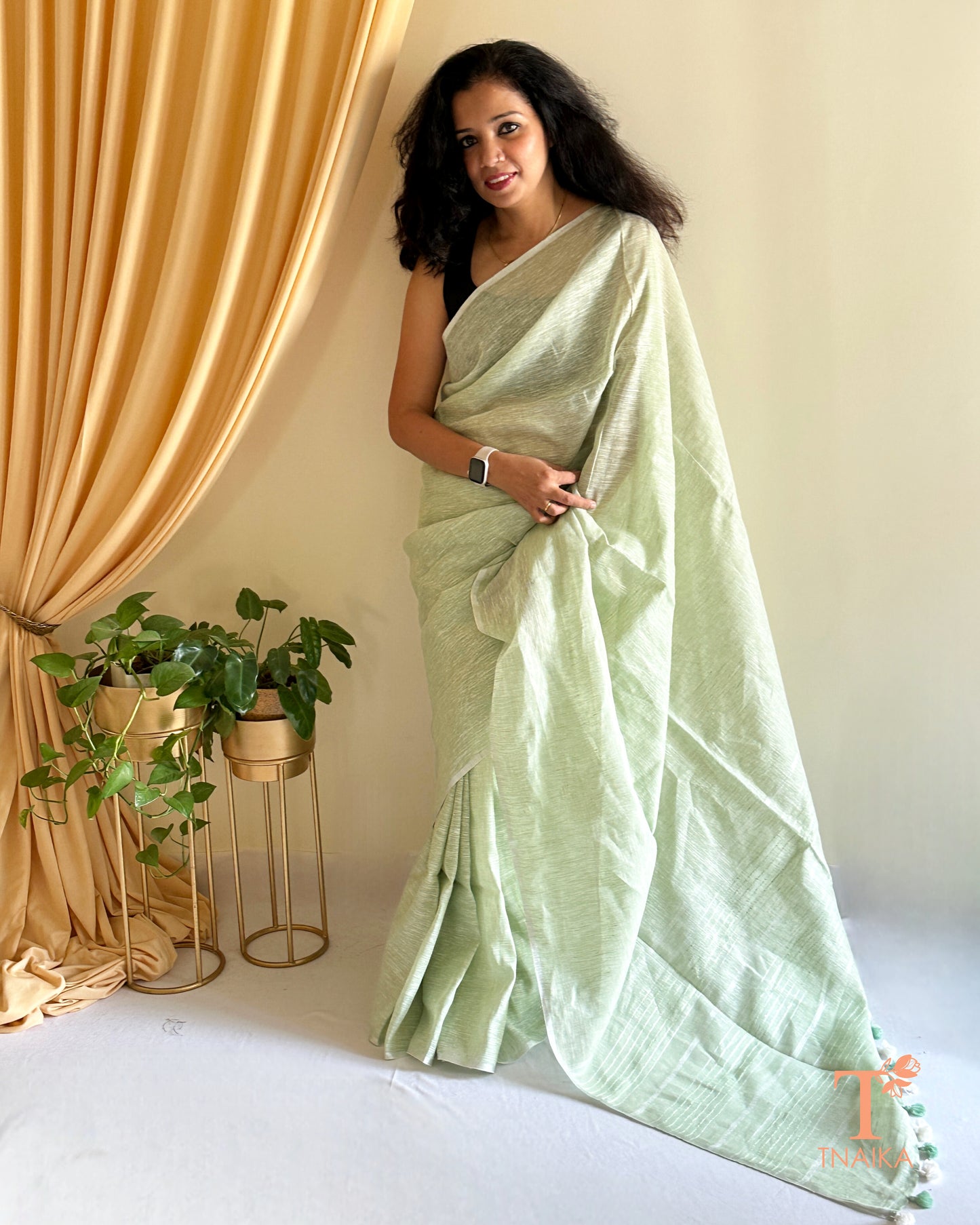 luxury linen saree for women with elegant gold detailing