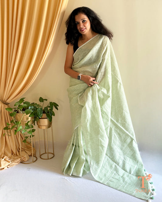 luxury linen saree for women with elegant gold detailing